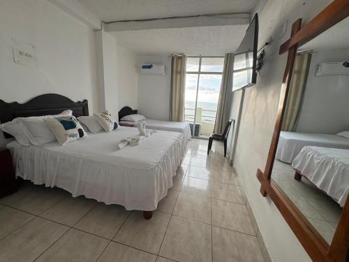 Ένα ή περισσότερα κρεβάτια σε δωμάτιο στο HOTEL PAL-MAR
