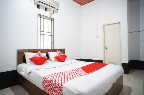 Ένα ή περισσότερα κρεβάτια σε δωμάτιο στο EMWEKA Guest House