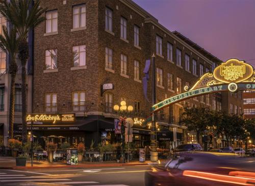 a car driving down a street in front of a building at Hilton San Diego Gaslamp Quarter in San Diego
