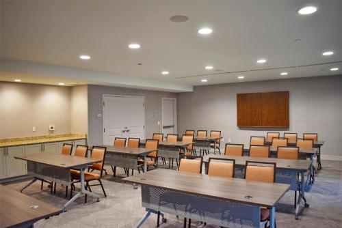 a conference room with tables and chairs and a podium at Hampton Inn and Suites Robbinsville in Robbinsville
