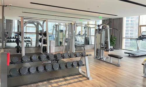 a gym with a bunch of equipment in a room at DoubleTree by Hilton Chongqing - Nan'an in Chongqing