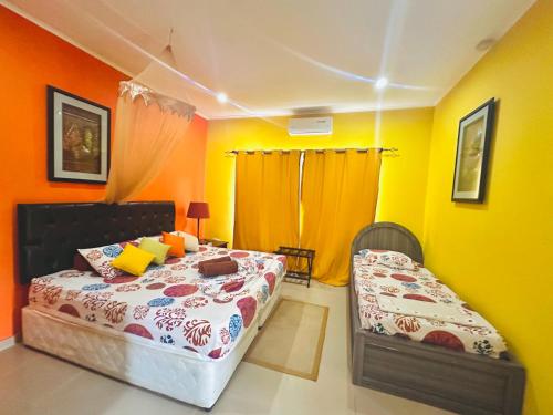 Katil atau katil-katil dalam bilik di Alha Villa