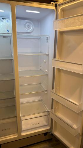 an open refrigerator with its door open and its shelves at Private Cozy R/V , for your enjoyment in Tamiami