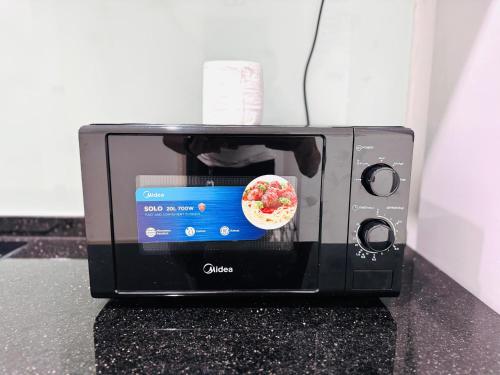 Hejmo Suitesにあるテレビまたはエンターテインメントセンター