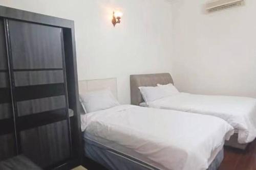 En eller flere senge i et værelse på Y.s.a Homestay(100mbps Wifi)