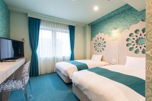 Tempat tidur dalam kamar di Hotel Wing International Select Hakata-Ekimae