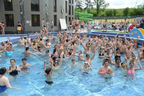 a large group of people in a swimming pool at Casa Cu Pridvor in Baile Felix