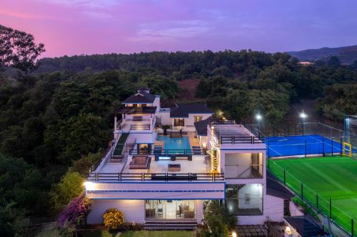 an aerial view of a house with a tennis court at CASA DIOS Luxury Villas in Khandala