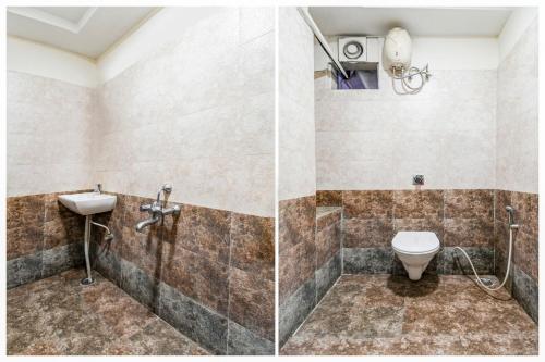 a bathroom with a toilet and a sink at Hotel O Raipur City Center Formerly Hotel Edge in Raipur