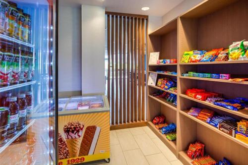 a store aisle with an ice cream shop at Holiday Inn Express & Suite Milroy - Reedsville By IHG in Burnham