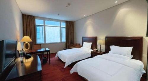 Letto o letti in una camera di Hongzhushan Hotel Mount Emei