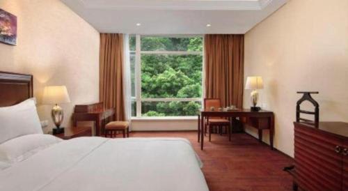 Letto o letti in una camera di Hongzhushan Hotel Mount Emei