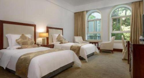 Letto o letti in una camera di Hongzhushan Hotel Mount Emei