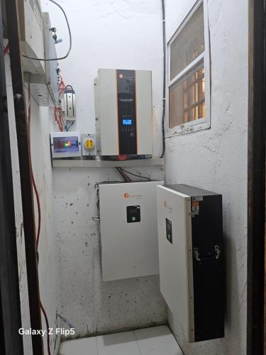 a room with a microwave and a small refrigerator at Luxury 3 bed rooms villa in Lekki