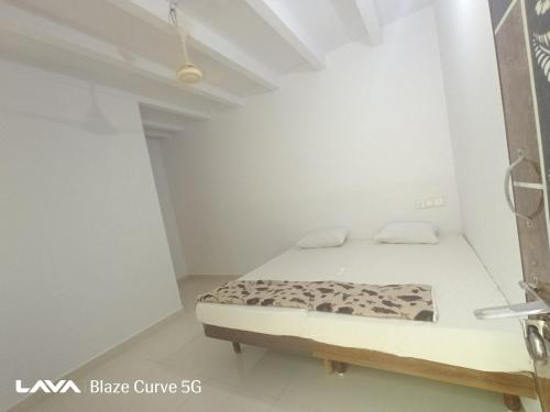 Ένα ή περισσότερα κρεβάτια σε δωμάτιο στο The Nest House Femily room