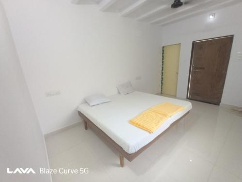 Ένα ή περισσότερα κρεβάτια σε δωμάτιο στο The Nest House Femily room