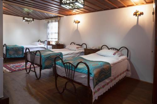 Postel nebo postele na pokoji v ubytování Lal Hotel Bursa