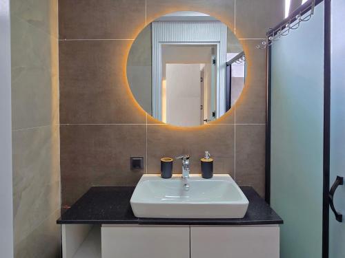 a bathroom with a sink and a mirror at Beys Serenity Villas - C in Kemer