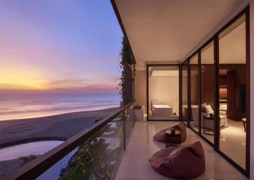 a room with a view of the ocean at Alila Seminyak in Seminyak