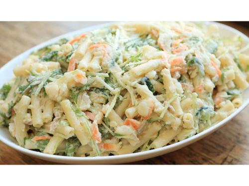 a bowl of pasta salad on a wooden table at Smile Hotel Kumamoto Suizenji - Vacation STAY 73093v in Kumamoto