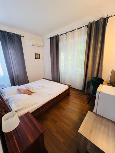 a bedroom with a bed and a large window at Villas Arbia - Rio by the Beach in Rab