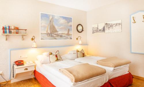 Postel nebo postele na pokoji v ubytování Hotel Friese