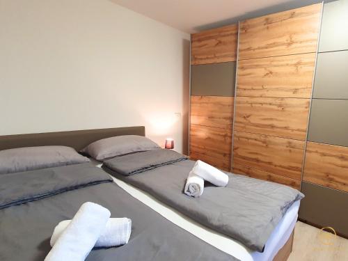 a bedroom with two beds with towels on them at Apartment Irene in Sečovlje