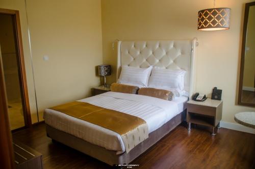 Säng eller sängar i ett rum på Hotel Inter Tete