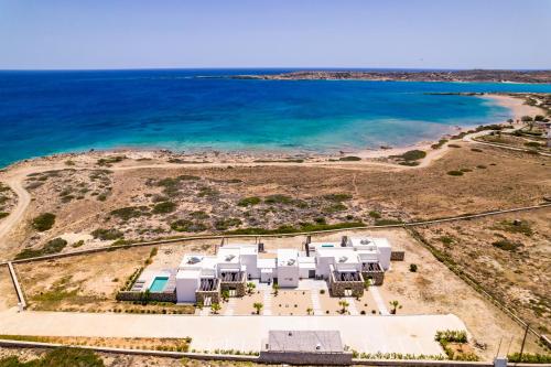 an aerial view of a white house on the beach at Cato Agro 1, Seafront Villa with Private Pool in Karpathos Town
