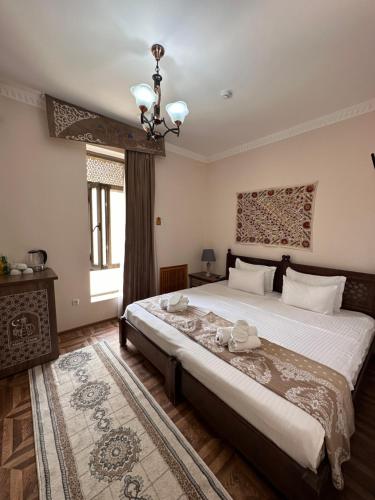 Ένα ή περισσότερα κρεβάτια σε δωμάτιο στο Hotel OROM with real discoun,t