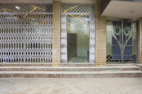 a building with stairs and a glass door at Hotel O Golden Key Rohini in New Delhi