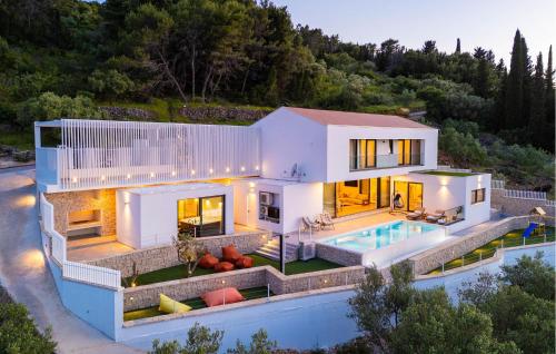 an aerial view of a house with a swimming pool at Lovely Home In Preko With Sauna in Preko