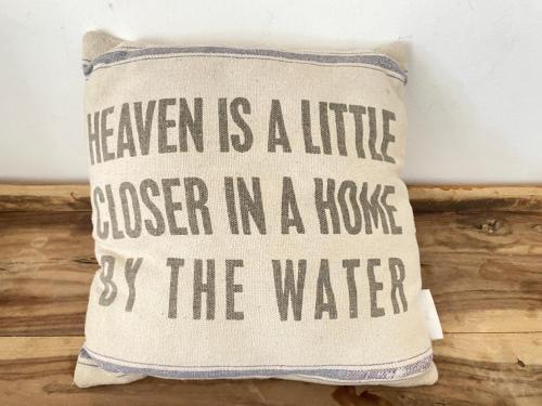 a pillow that says heaven is a little closer in a house by the water at My Charming Flat - Sea Front View in Rivabella