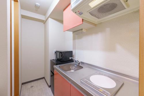 USP HOTEL Kitahorieにあるキッチンまたは簡易キッチン