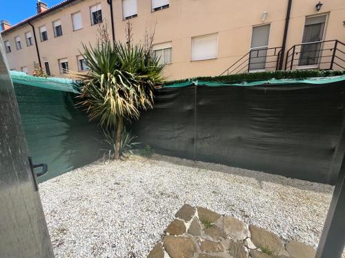 a black fence in front of a building at Pirineo Aragonés. Casa La Paz in Sabiñánigo