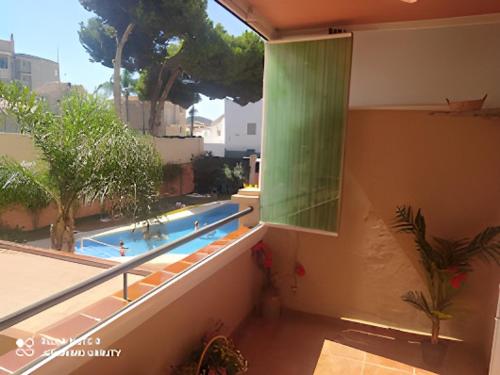 a view of a swimming pool from a balcony at Apartamento Mirasol con parking privado in Fuengirola