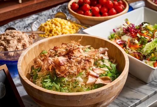 a bowl of salad and other foods on a table at Rantei in Sendai