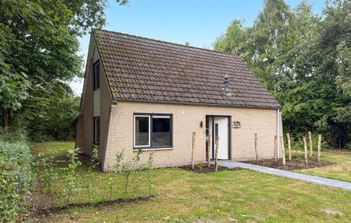a small house in the middle of a field at 3 Bedroom Stunning Home In Hoeven in Hoeven