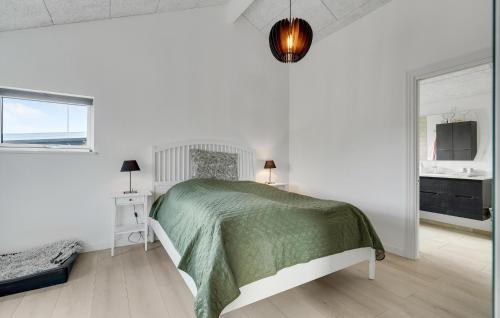 a white bedroom with a bed and a window at Amazing Home In Nyborg With Wifi in Nyborg