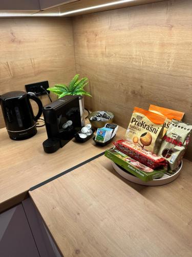 a counter with a bowl of food and a book at New apartment in Sarajevo