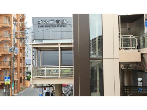 a building with a sign on the side of it at Smile Hotel Kumamoto Suizenji - Vacation STAY 73106v in Kumamoto