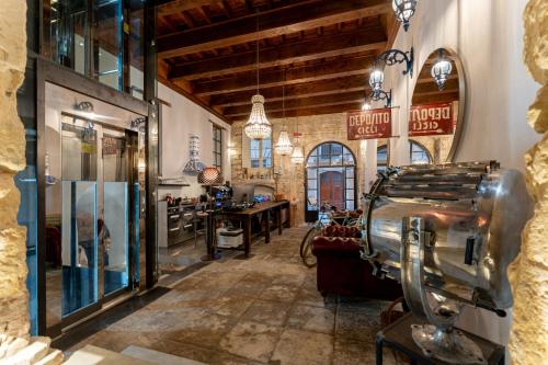 a large room with a barber shop with a machine in it at Hotel D H Lawrence in Cagliari