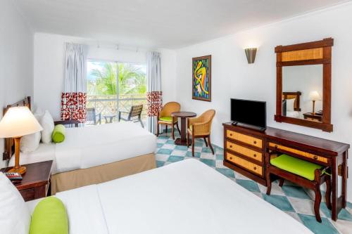 Un ou plusieurs lits dans un hébergement de l'établissement Grand Decameron Panama, A Trademark All Inclusive Resort
