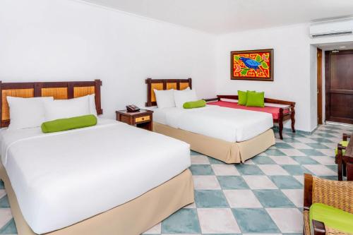 Un ou plusieurs lits dans un hébergement de l'établissement Grand Decameron Panama, A Trademark All Inclusive Resort