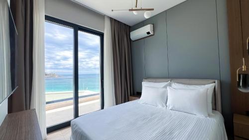 Postel nebo postele na pokoji v ubytování Apart hotel Emiia