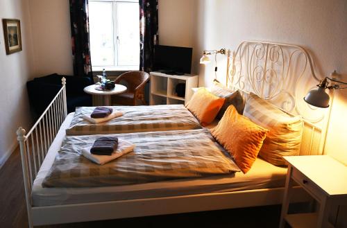 a bedroom with two beds with towels on them at Nordfriesisches Haus in Tönning