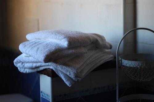 a pile of towels sitting on top of a box at Agriturismo Cardella in Piobbico