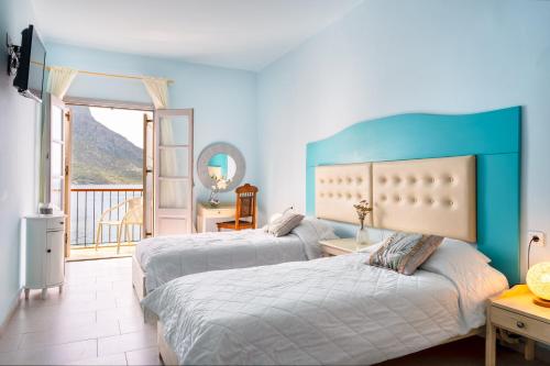 Ένα ή περισσότερα κρεβάτια σε δωμάτιο στο MasouriBlu Boutique Hotel