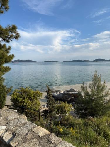 a view of a large body of water at Luxury Pearl Porto Peramos in Néa Péramos