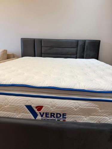 a mattress on a bed frame in a room at Lukas Apartament Vollga Durres in Durrës